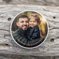 Close-up of personalised candle lid printed with a photo of a father and young child, with Happy Father s Day to the Best Dad Ever text around the edge.