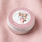 Personalised party favour candle tin with lid removed, showing natural olive wax candle and cotton wick inside — vegan and cruelty-free