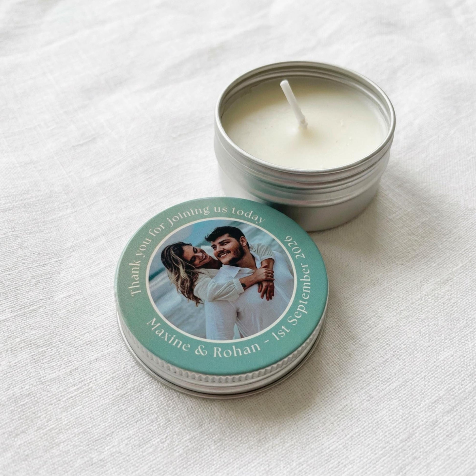 Group of personalised mini party favour candle tins with colour-printed photo lids, ideal as birthday, christening or baby shower favours