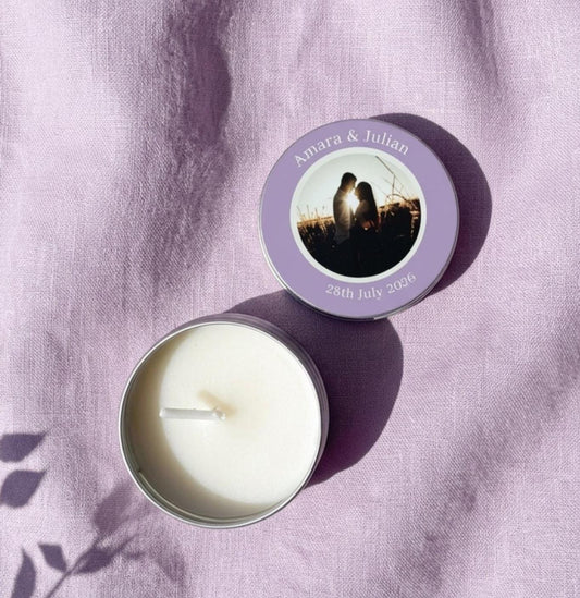 Personalised party favour candle tins with colour-printed photo lids, styled flat lay — handmade with natural olive wax in the Cotswolds