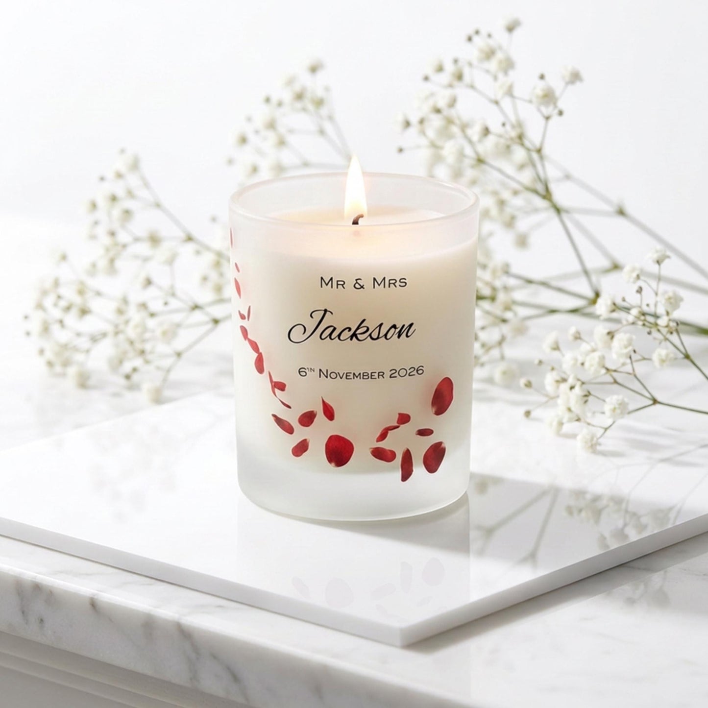 Personalised wedding candle with red rose petals, names and date printed on frosted glass