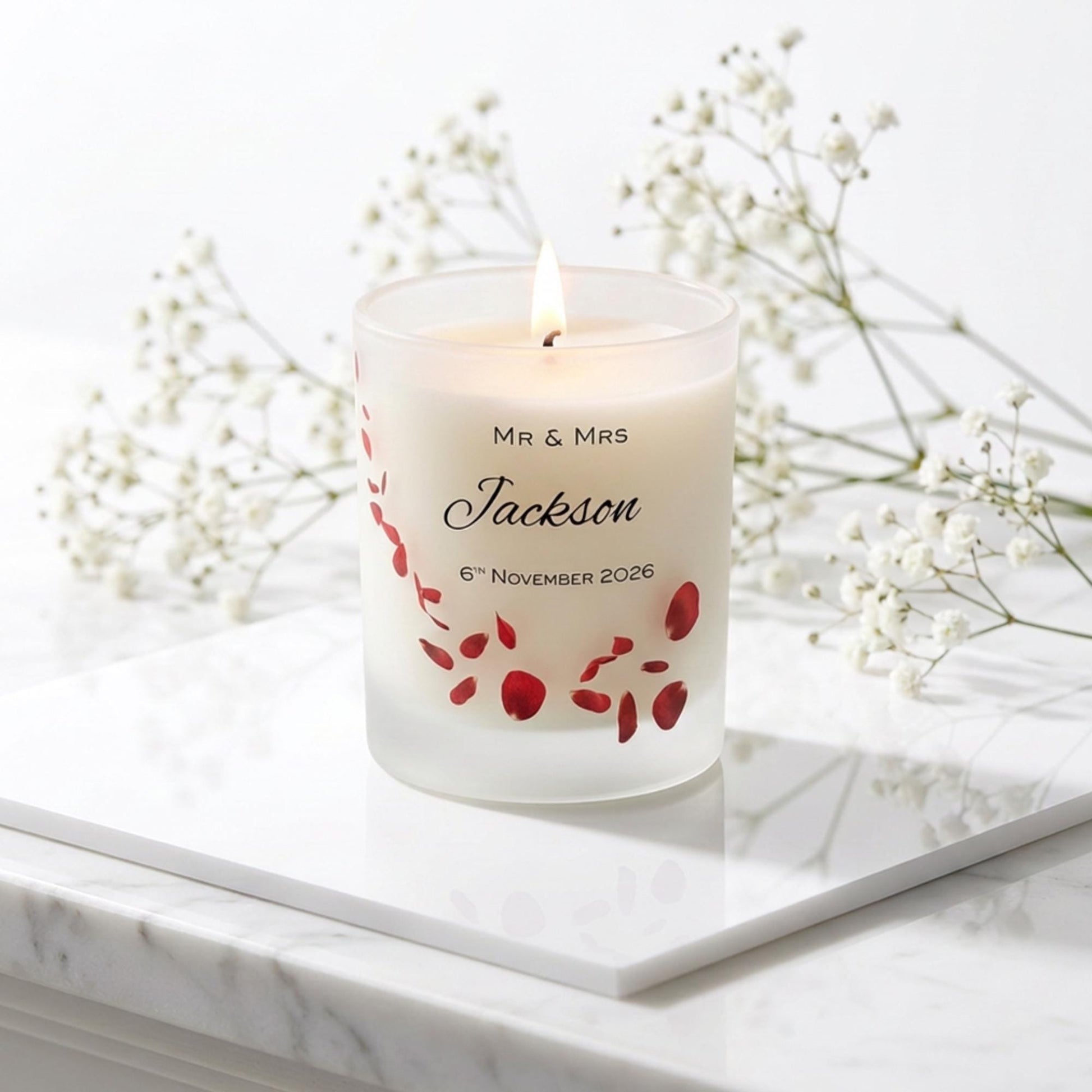 Personalised wedding candle with red rose petals, names and date printed on frosted glass
