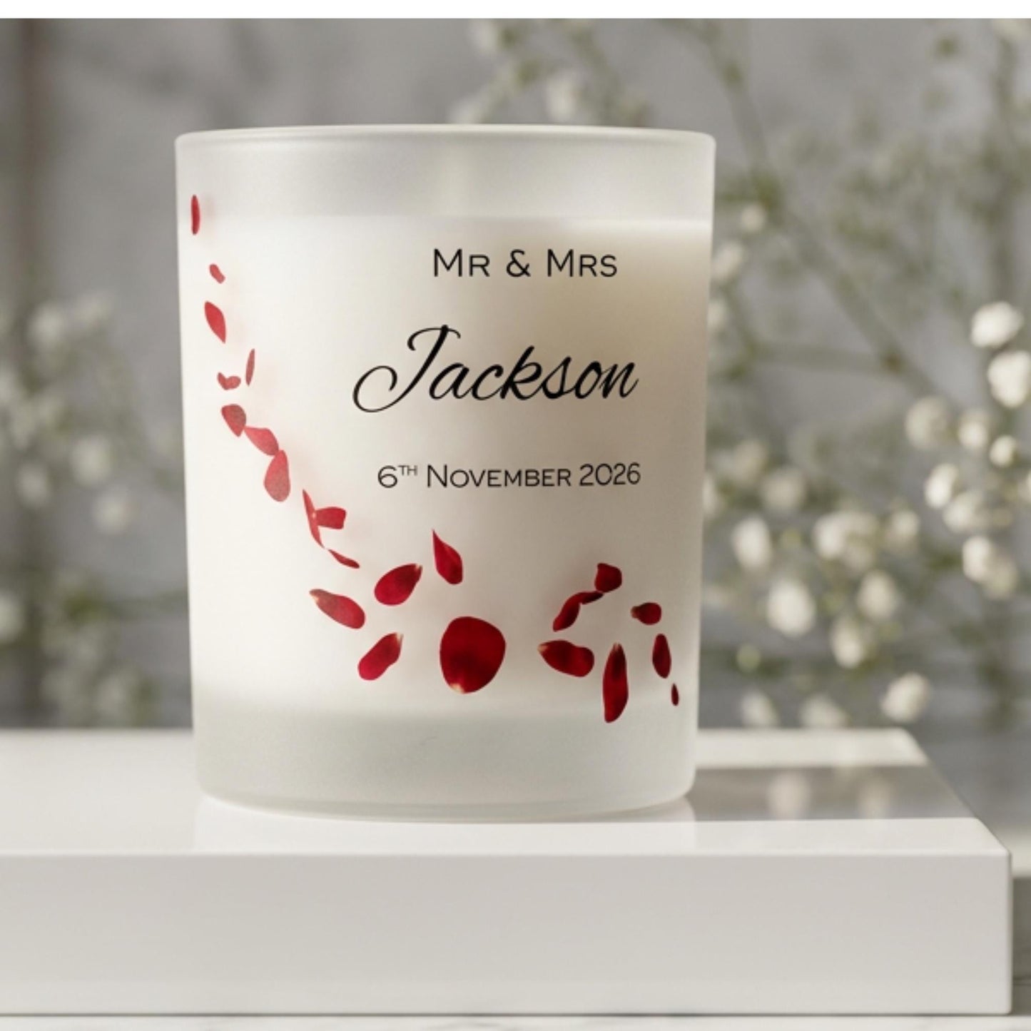 Personalised wedding candle with red rose petals, names and date printed on frosted glass