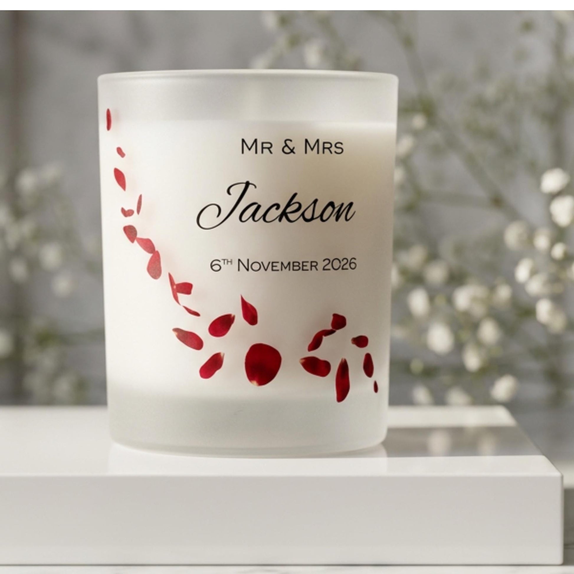 Personalised wedding candle with red rose petals, names and date printed on frosted glass