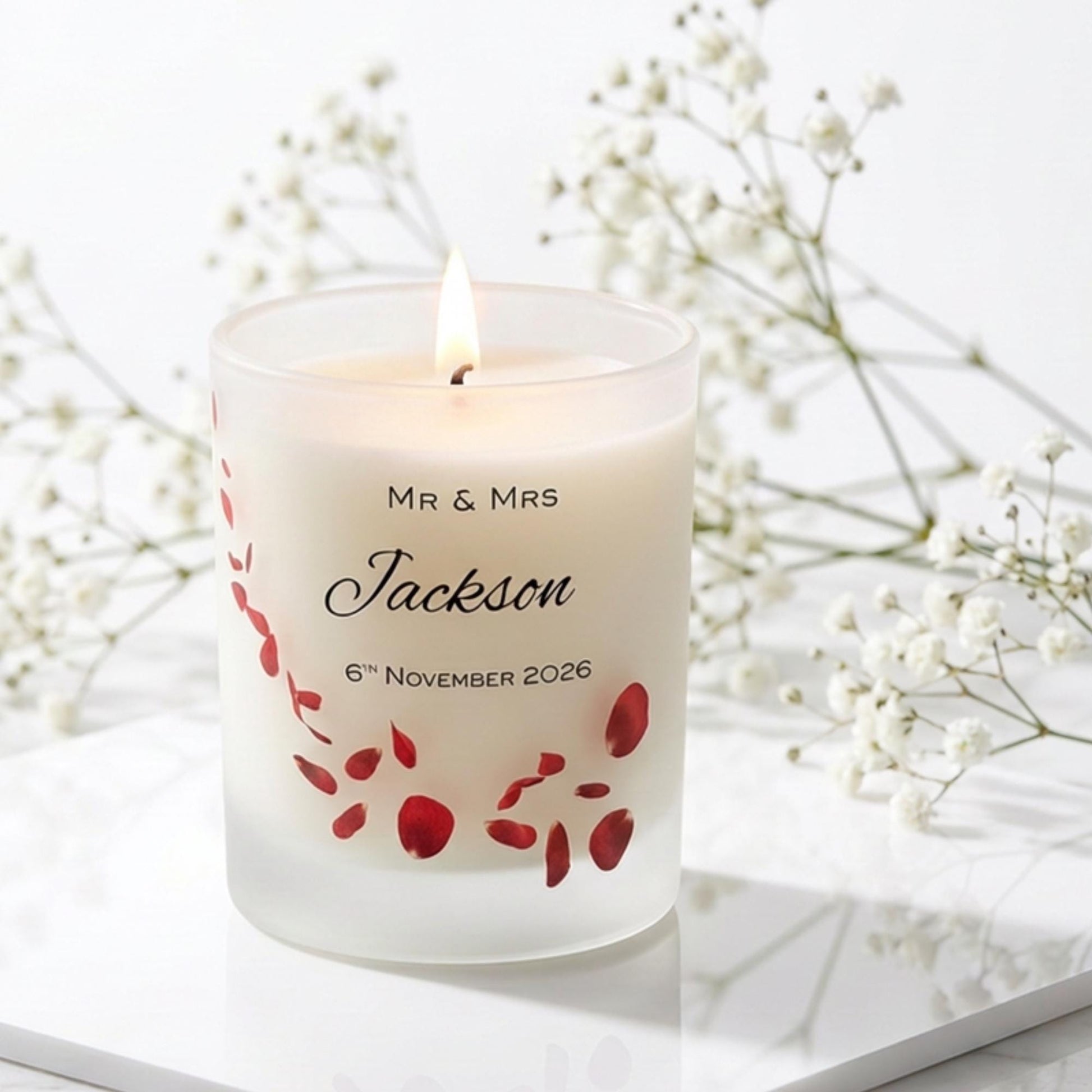 Personalised wedding candle with red rose petals, names and date printed on frosted glass