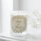 Personalised wedding candle with names and date in a hand-drawn daisy design on frosted glass