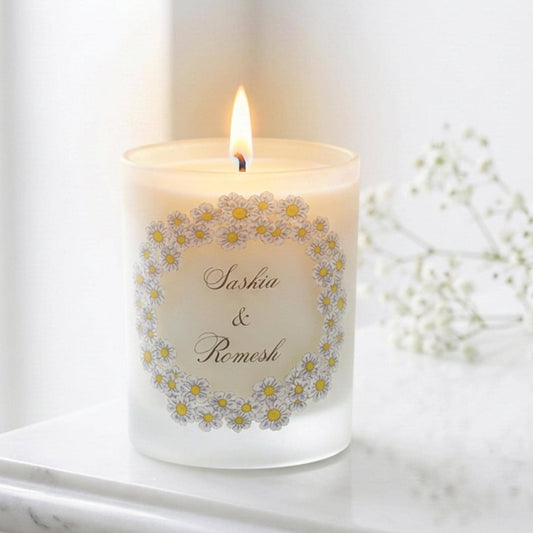 Personalised wedding candle with names and date in a hand-drawn daisy design on frosted glass