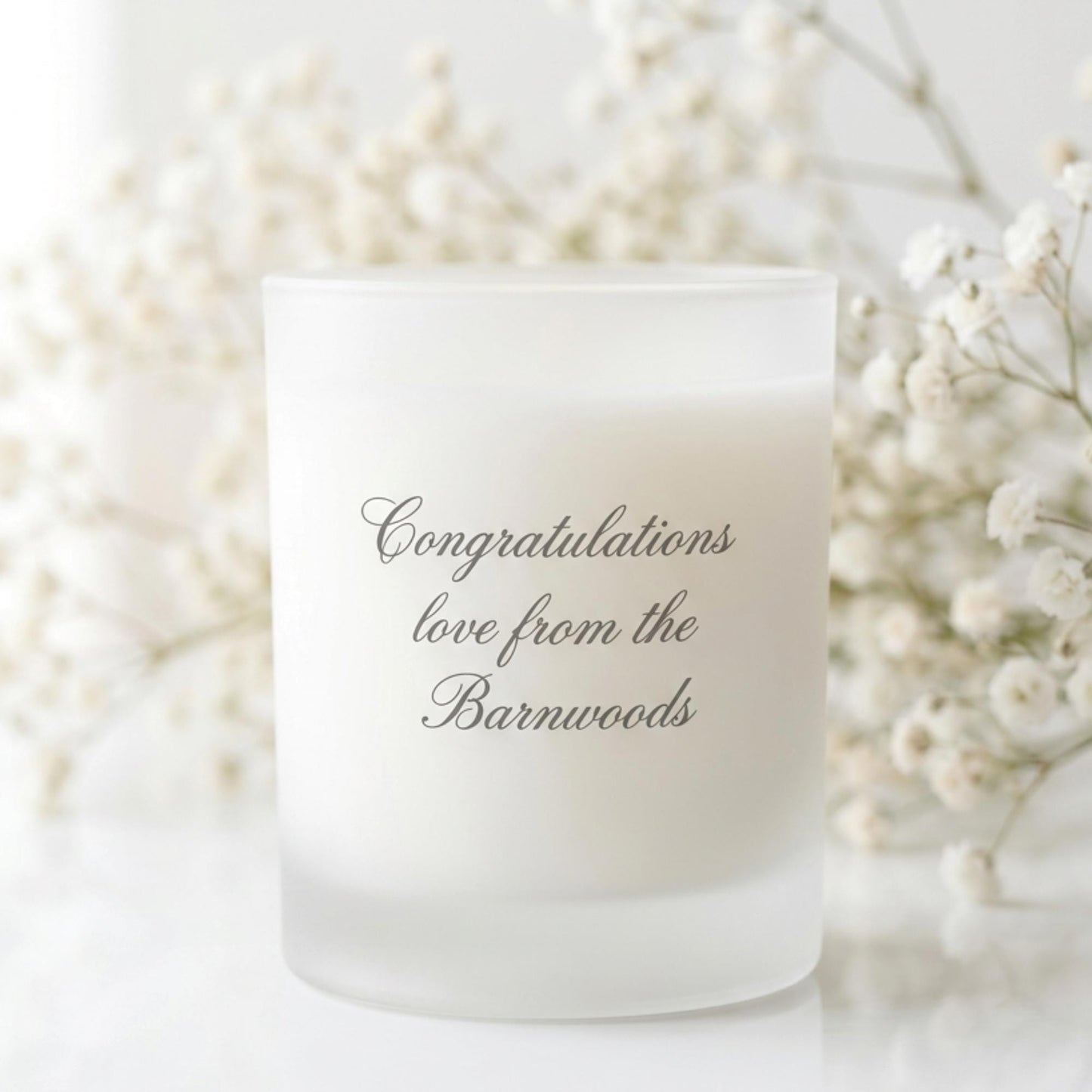 Personalised wedding candle with names and date in a hand-drawn daisy design on frosted glass