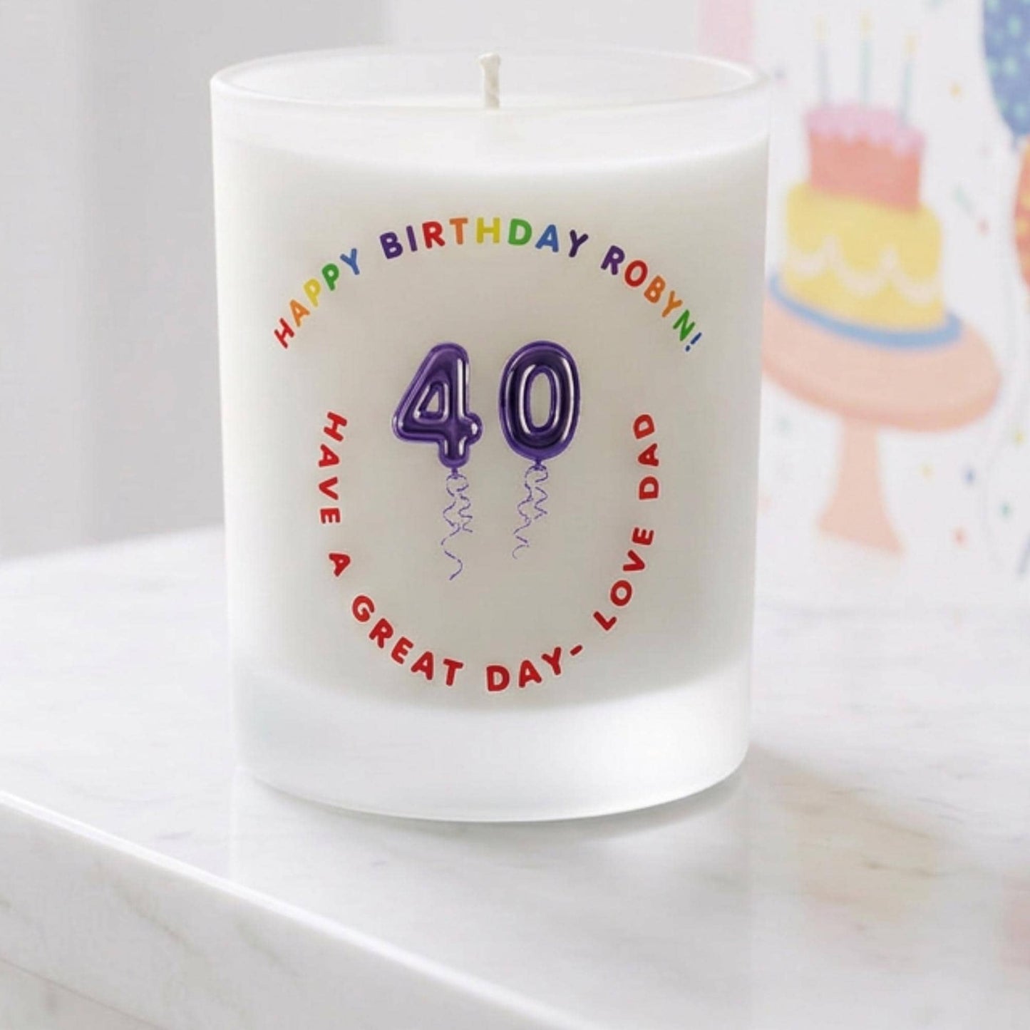 Personalised birthday candle with name and age in balloon numbers printed on frosted glass