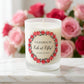 Personalised birthday candle with a rose wreath design and custom wording printed on frosted glass