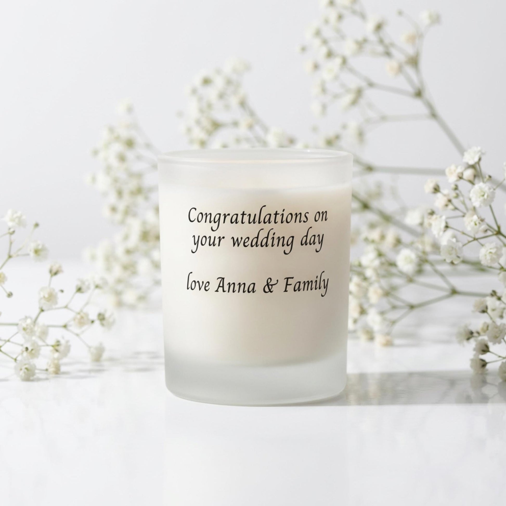 Personalised wedding candle with red rose petals, names and date printed on frosted glass