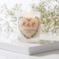Personalised wedding candle with couple's initials and date in a boho floral heart design