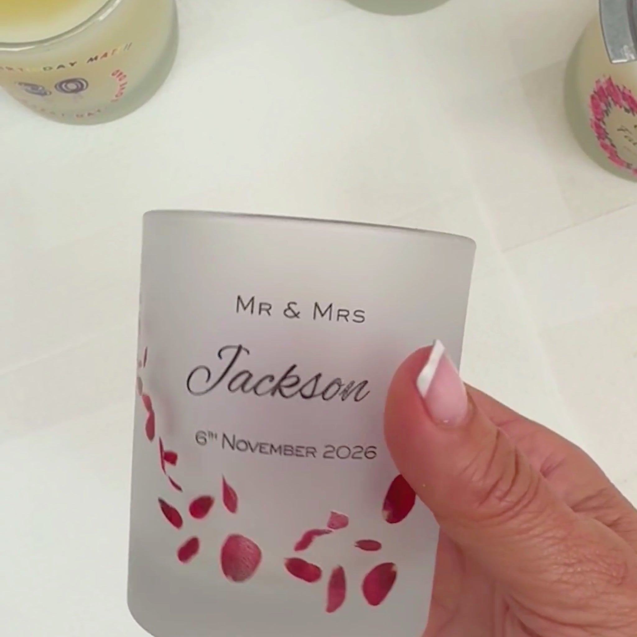Personalised wedding candle video showing the red rose petal design