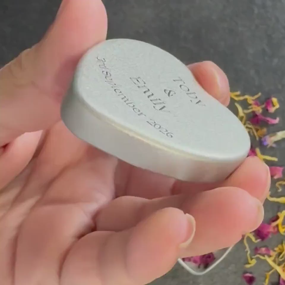 Video showing personalised logo tins in heart and round shapes