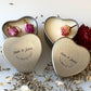Personalised candle wedding favour in a gold heart tin with natural confetti