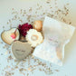 Personalised candle wedding favour in a gold heart tin with natural confetti
